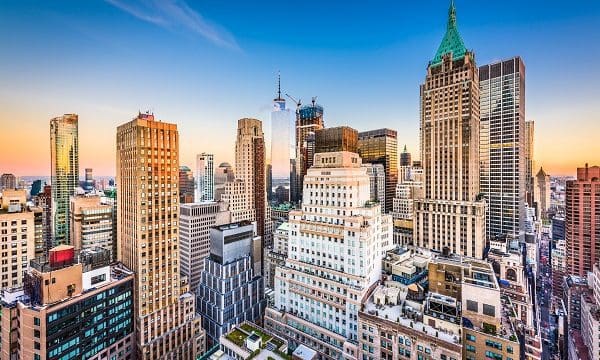 New York City Financial District cityscape at dusk.
