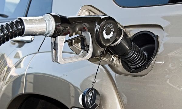 A gasoline pump fills a car with premium fuel.