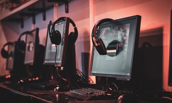 Photo of comfortable room for serious gamers with computers and earphones.