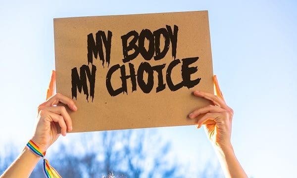 A woman holding a sign in favor of the legalization of abortion. Protest not to make abortion illegal in the united states, pro-choice, pro-life