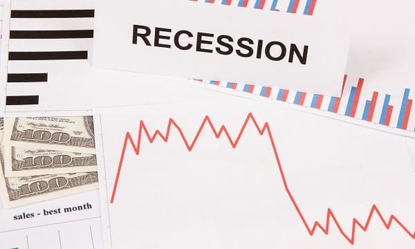 Inscription recession, currencies dollar and declining chart as risk of global financial crisis caused by coronavirus. Covid-19