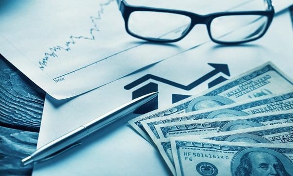 Still Life of Business Items with graph and Dollars