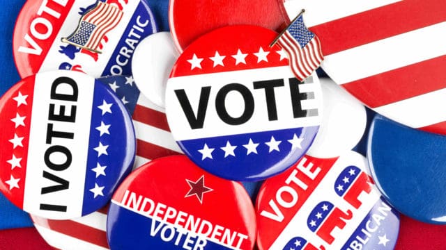 A colorful collection of American national political vote badges,