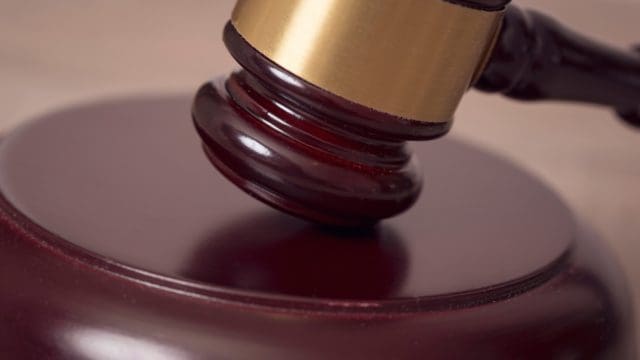 Close up of a judge gavel in a courtroom. Selective focus