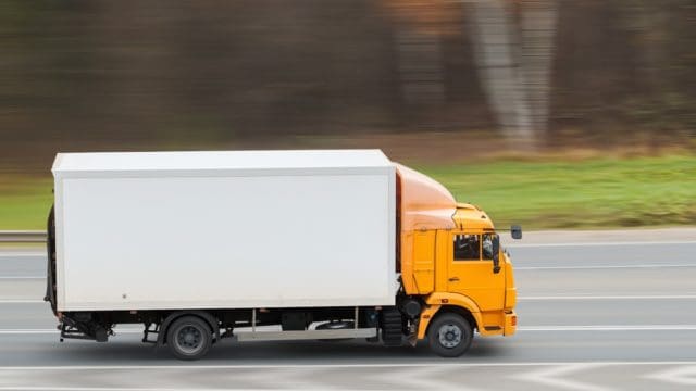 Truck driving on the freeway top view medium plan