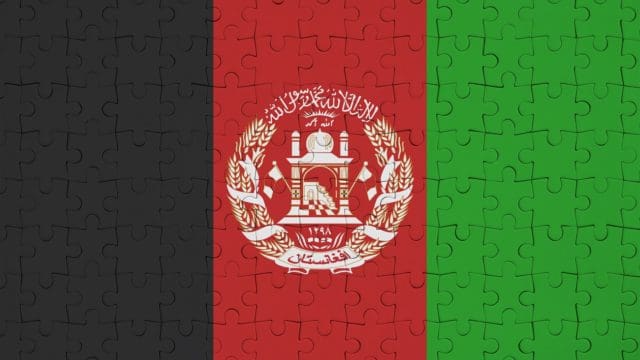Afghanistan flag is depicted on a folded puzzle