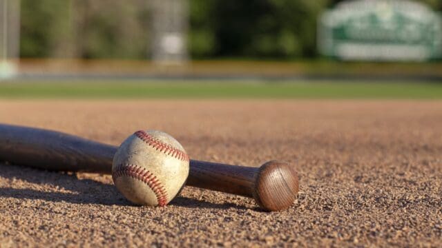 Baseball and bat low angle selective focus view on a baseball field