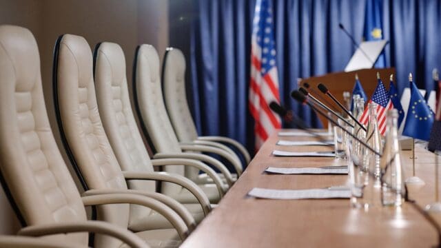 Empty places with microphones for business people during international conference