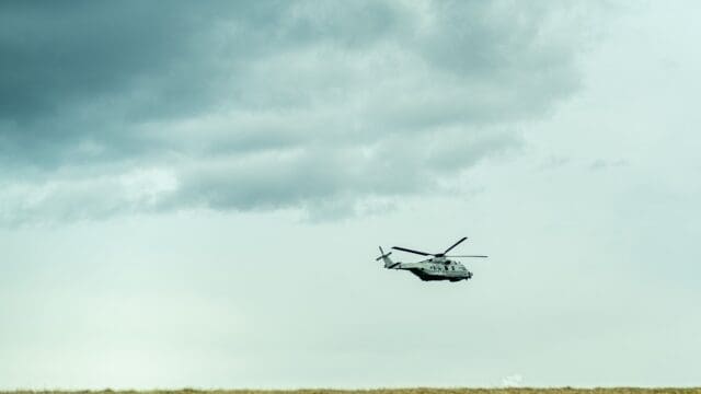 A helicopter over a field