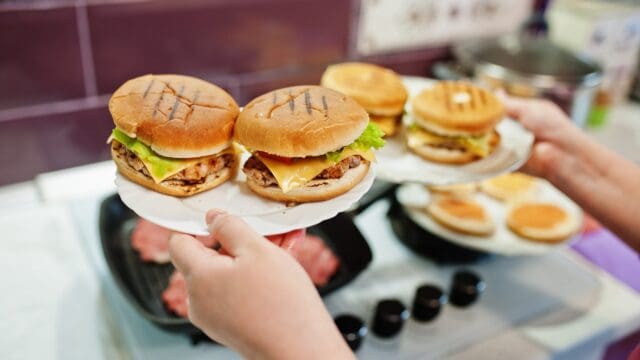 Сooking burgers in the kitchen at home during quarantine time.