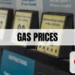 Text which says Gas Prices with the AAA logo in the lower-right-hand corner with gas pumps in the background
