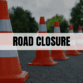 Text saying Road Closure with orange traffic cones in the background.