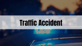 Rectangle containing the text Traffic Accident with police car lights in the background