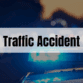 Rectangle containing the text Traffic Accident with police car lights in the background