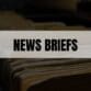 Text that says News Briefs on a white rectangle with file folders in the background