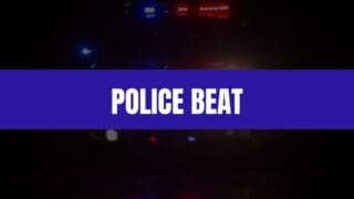 Text that says Police Beat on a blue rectangle with a police car with lights on in the background