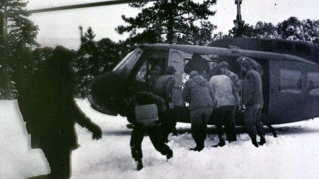 Georgia National Guard soldiers load supplies into a helicopter during the winter of 1973. (National Guard photo)