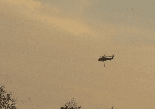 A helicopter helps fight the White County fire.  (White Co. Public Safety photo)