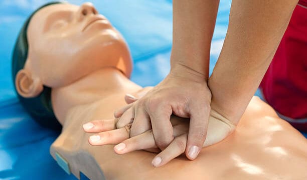 CPR training - Chest compressions performed on a CPR dummy